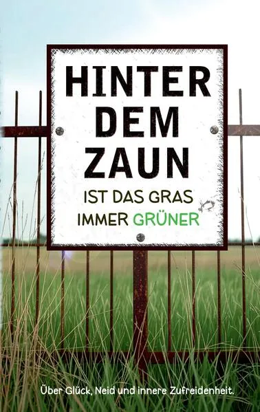 Hinter dem Zaun ist das Gras immer grüner